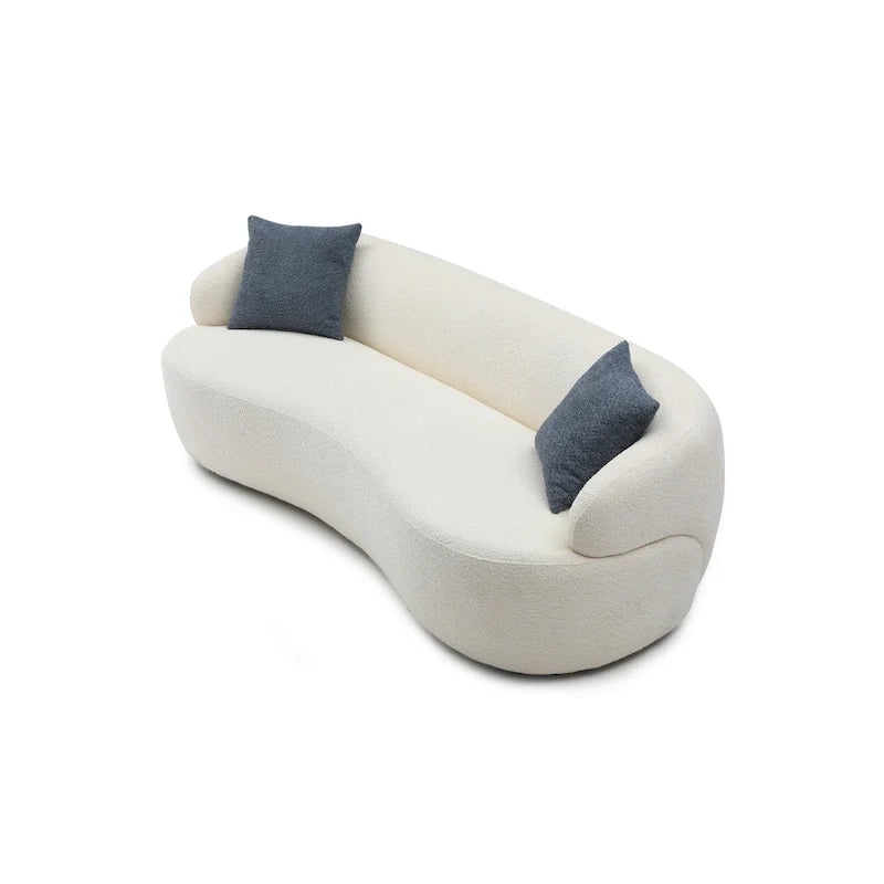 Beżowa, zaokrąglona sofa w stylu mid-century modern