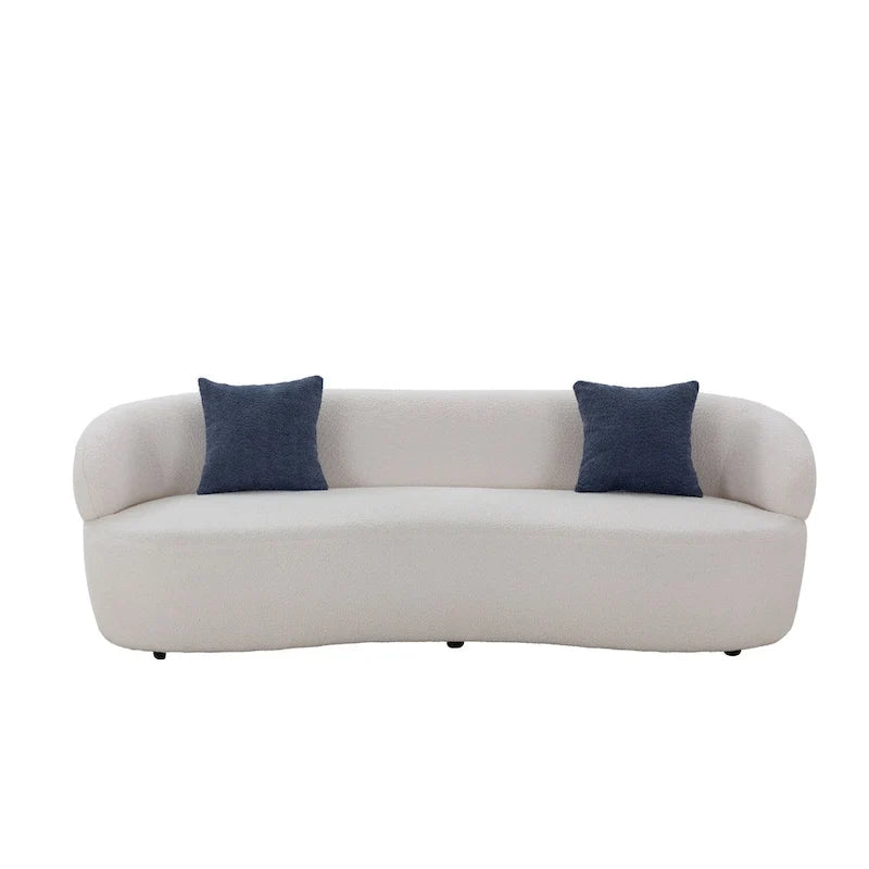 Beżowa, zaokrąglona sofa w stylu mid-century modern