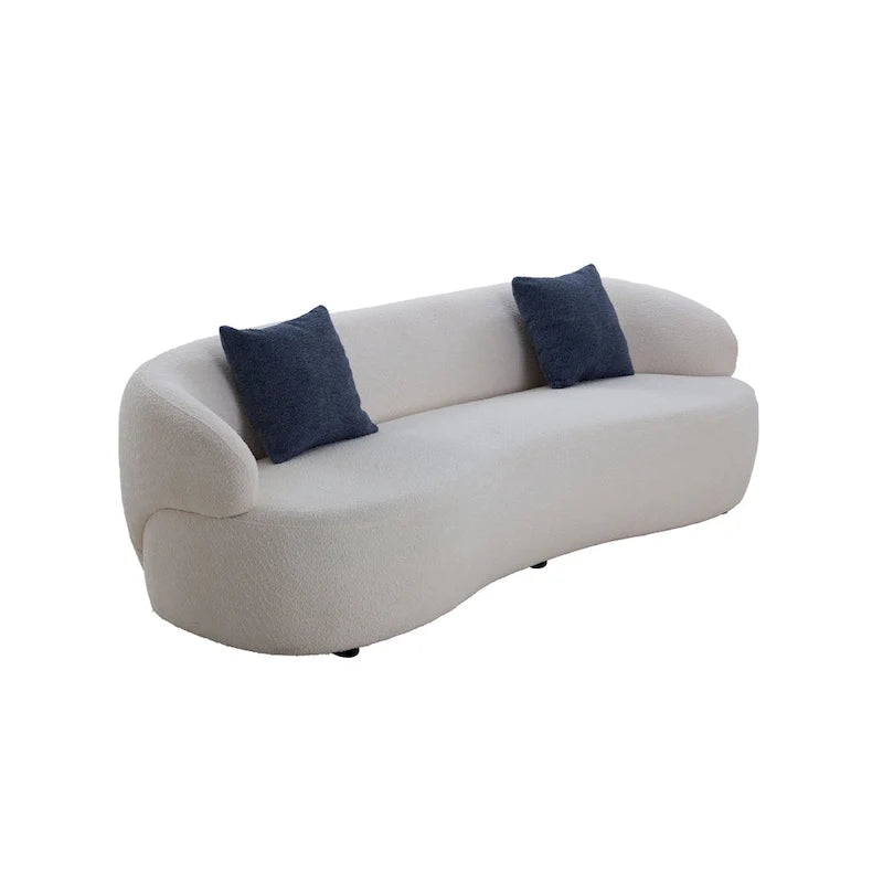 Beżowa, zaokrąglona sofa w stylu mid-century modern