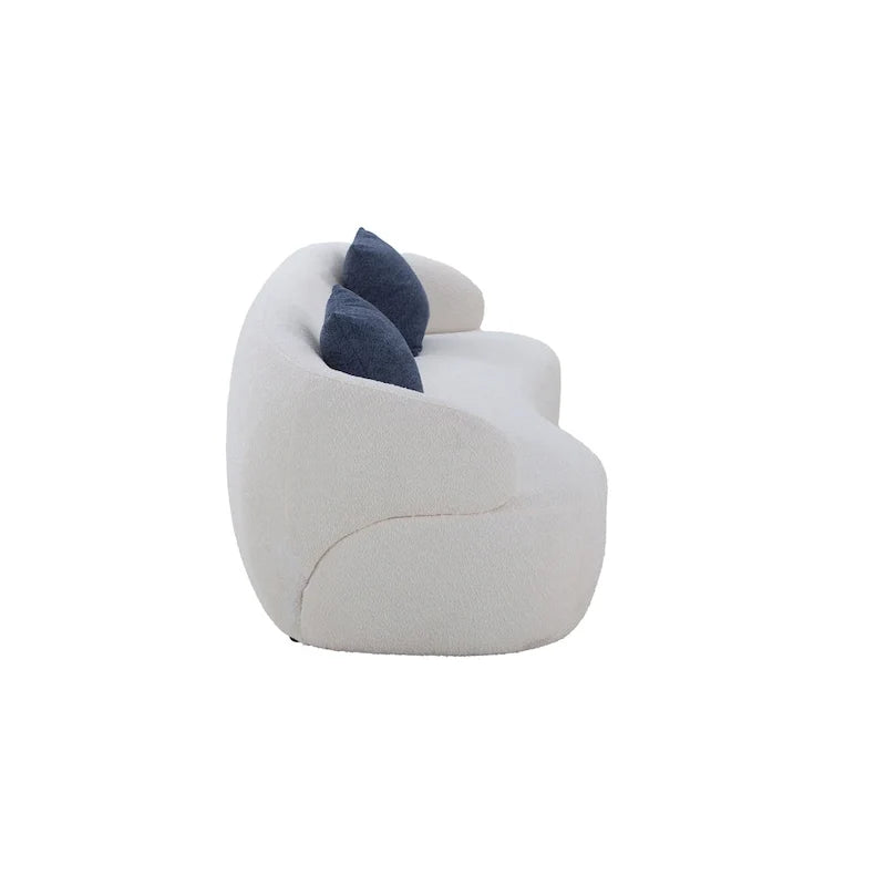 Beżowa, zaokrąglona sofa w stylu mid-century modern