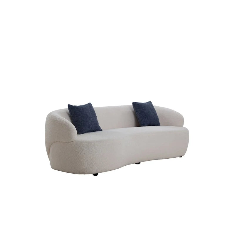 Beżowa, zaokrąglona sofa w stylu mid-century modern