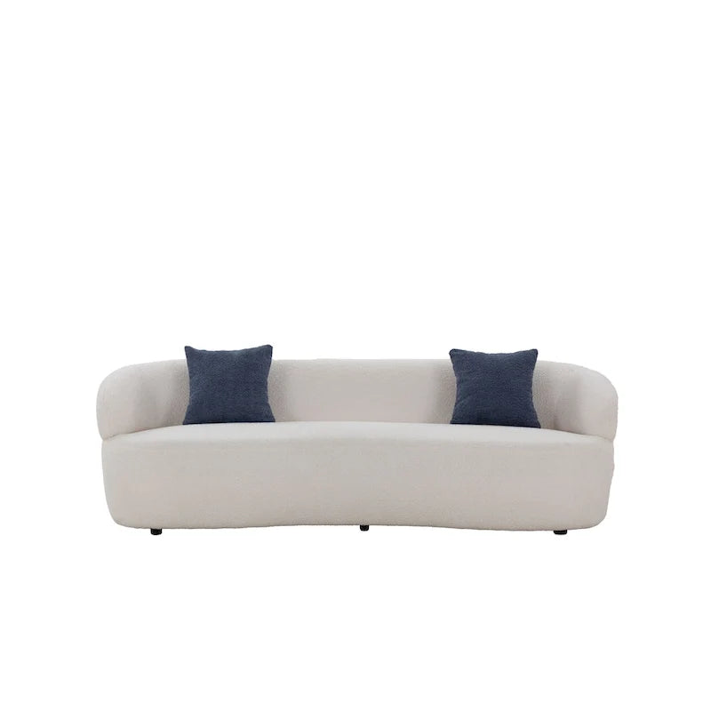 Beżowa, zaokrąglona sofa w stylu mid-century modern